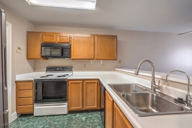 kitchen featuring dark tile patterned flooring, sink, and black appliances