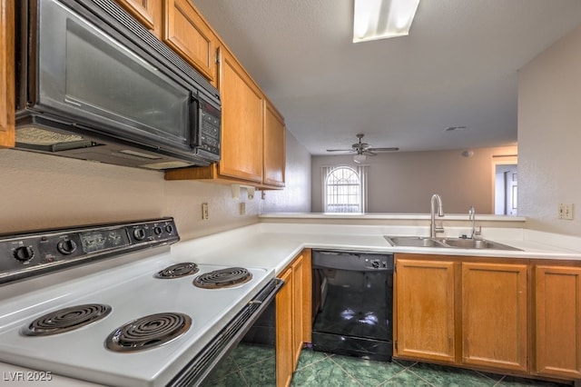 kitchen featuring sink, kitchen peninsula, ceiling fan, and black appliances