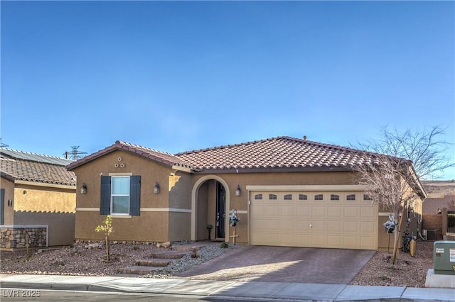 mediterranean / spanish-style house featuring a garage