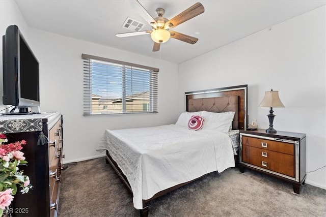 bedroom featuring dark colored carpet and ceiling fan