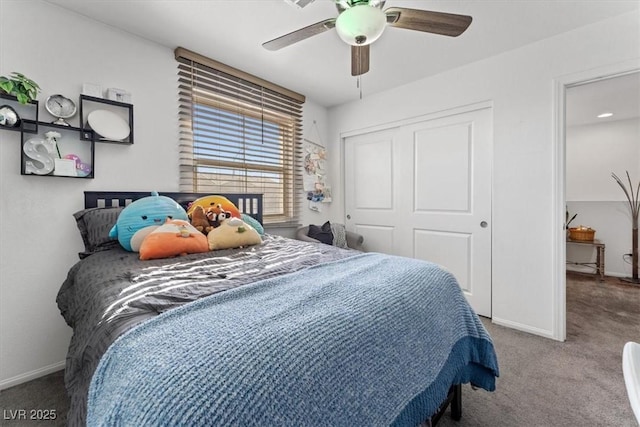 carpeted bedroom featuring a closet and ceiling fan