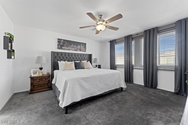 bedroom featuring ceiling fan and dark colored carpet