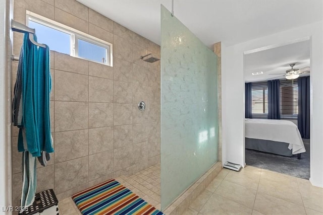 bathroom with a tile shower, tile patterned floors, and ceiling fan