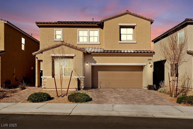 mediterranean / spanish house featuring a garage