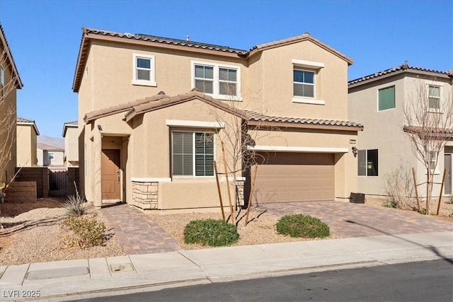 mediterranean / spanish-style home featuring a garage