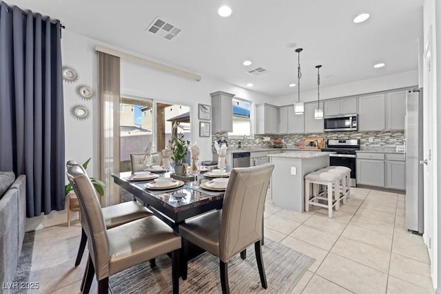 tiled dining area with sink