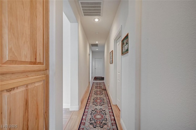 corridor featuring light hardwood / wood-style flooring