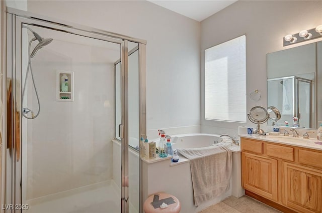 bathroom with vanity, plus walk in shower, and tile patterned flooring