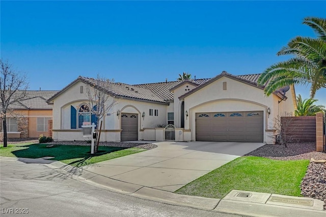 mediterranean / spanish-style home with a garage