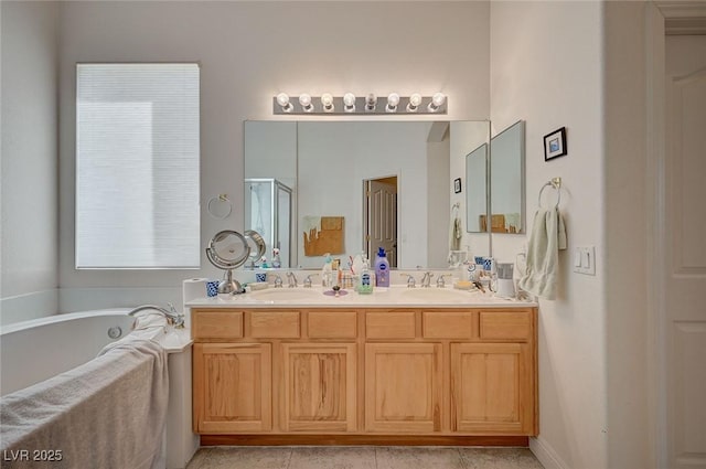 bathroom with plus walk in shower, vanity, and tile patterned floors