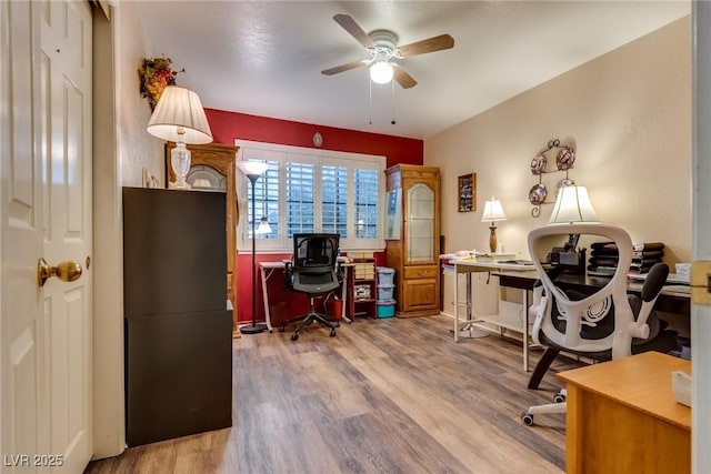 office space featuring wood-type flooring and ceiling fan