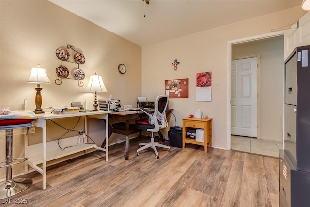 office with light wood-type flooring