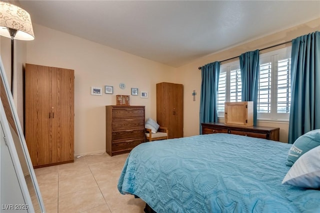 bedroom featuring light tile patterned floors