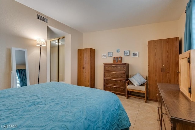 bedroom with light tile patterned floors