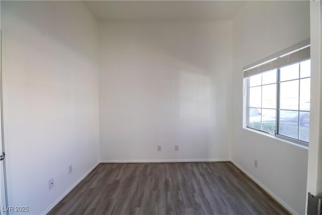 empty room featuring dark hardwood / wood-style floors