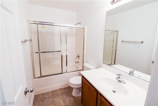 full bathroom with vanity, shower / bath combination with glass door, and toilet