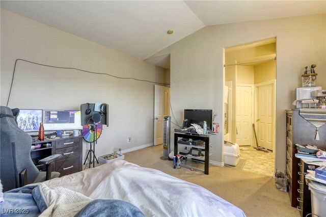 carpeted bedroom featuring lofted ceiling