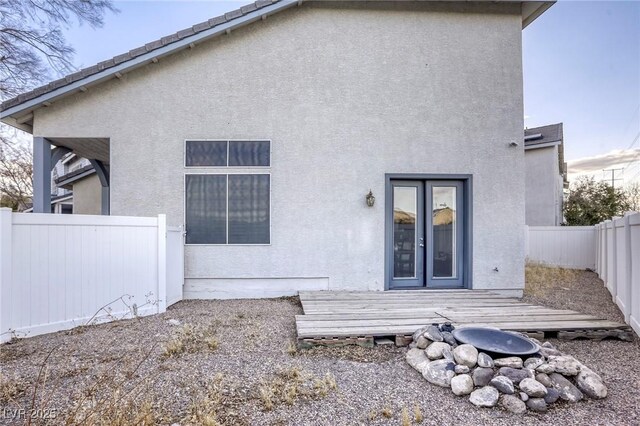 rear view of house featuring a deck