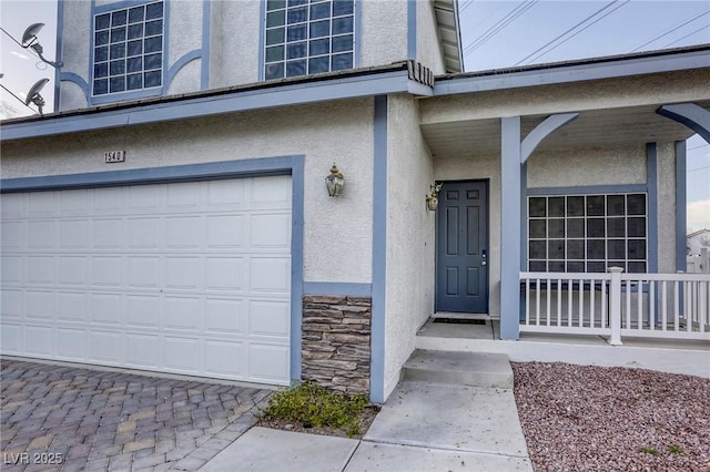 entrance to property featuring a garage