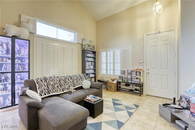 tiled living room with high vaulted ceiling