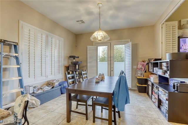 tiled dining room with french doors