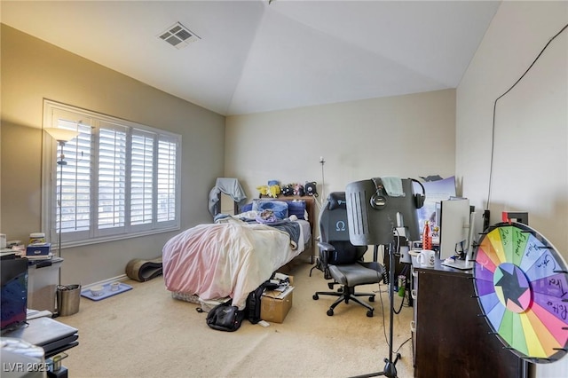 bedroom with vaulted ceiling and carpet