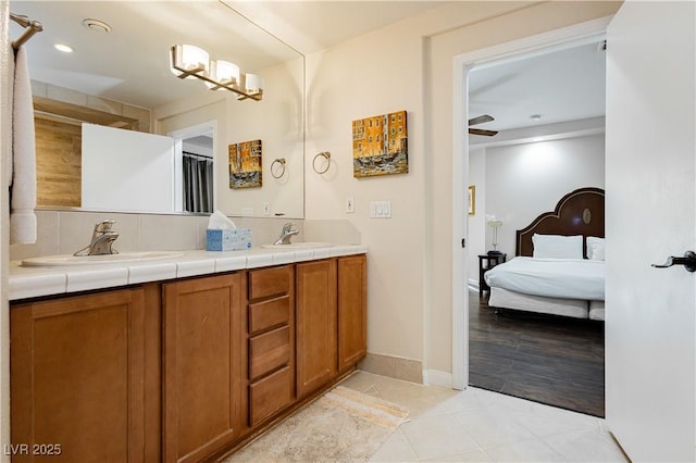 bathroom featuring tile patterned flooring and vanity