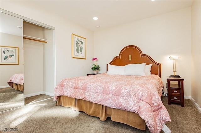 bedroom with carpet and a closet