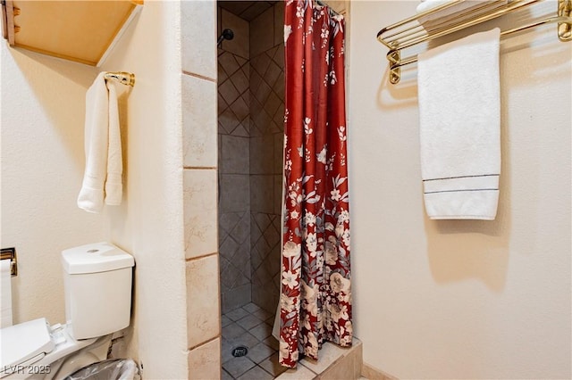 bathroom with walk in shower and toilet