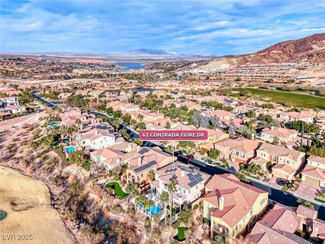 birds eye view of property with a mountain view