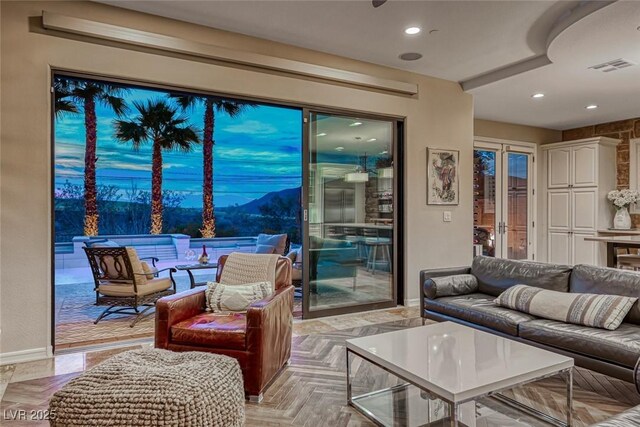 living room with a mountain view and light parquet flooring