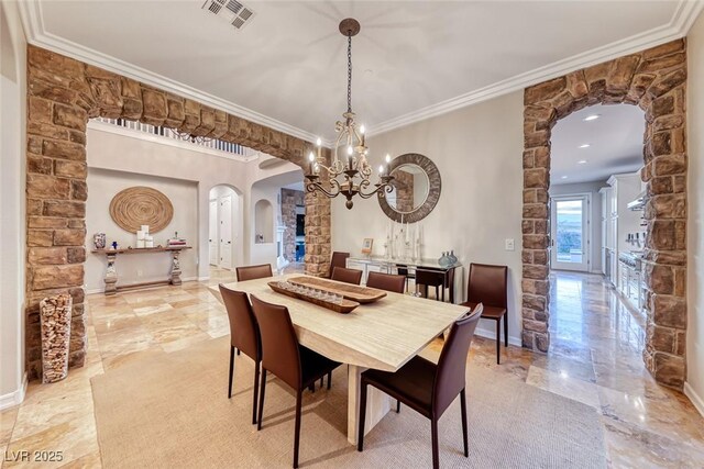 dining space featuring an inviting chandelier and ornamental molding