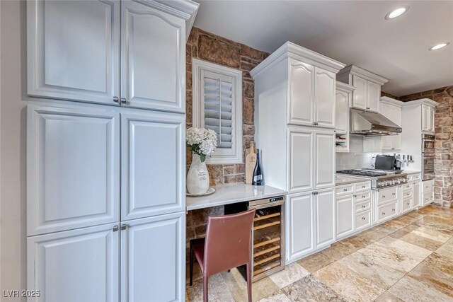 kitchen featuring backsplash, stainless steel gas cooktop, and white cabinets