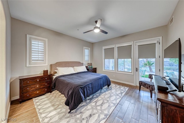 bedroom with ceiling fan, light wood-type flooring, and access to outside