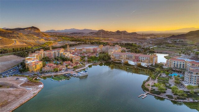 aerial view at dusk with a water and mountain view