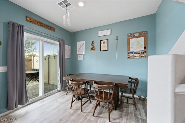 dining room featuring wood-type flooring