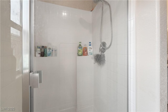 bathroom featuring an enclosed shower