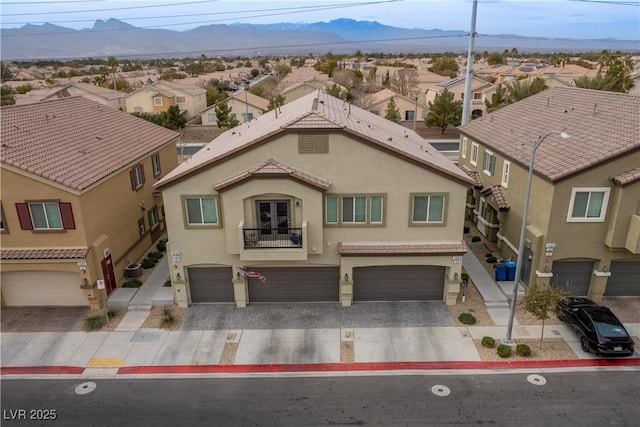 view of front of house featuring a mountain view and a garage