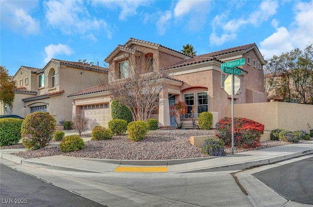 mediterranean / spanish-style house featuring a garage