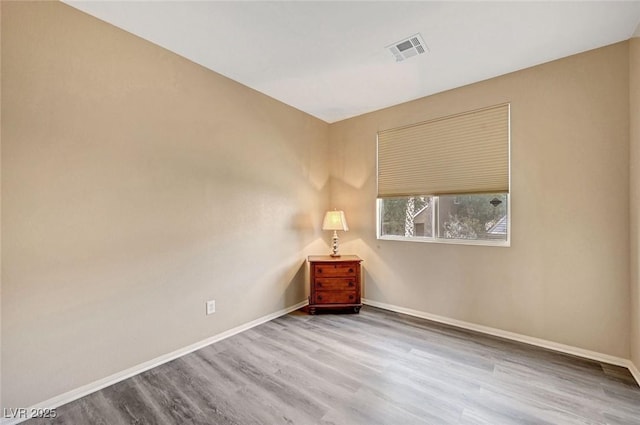 empty room featuring wood-type flooring