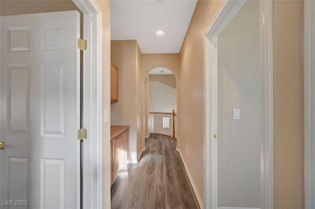 hall with hardwood / wood-style floors