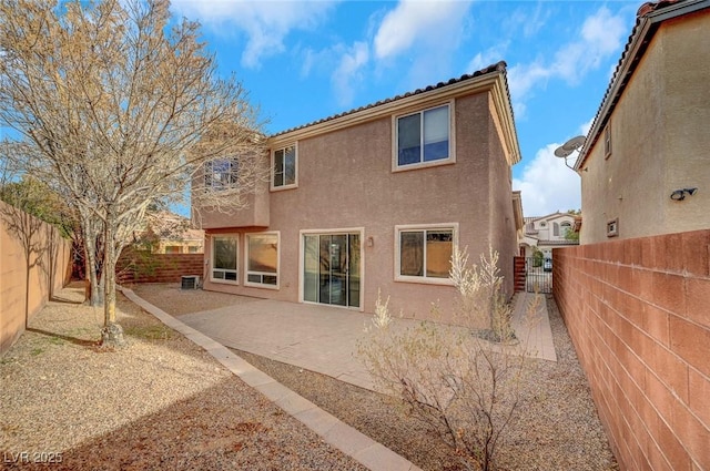 back of property featuring a patio and central air condition unit