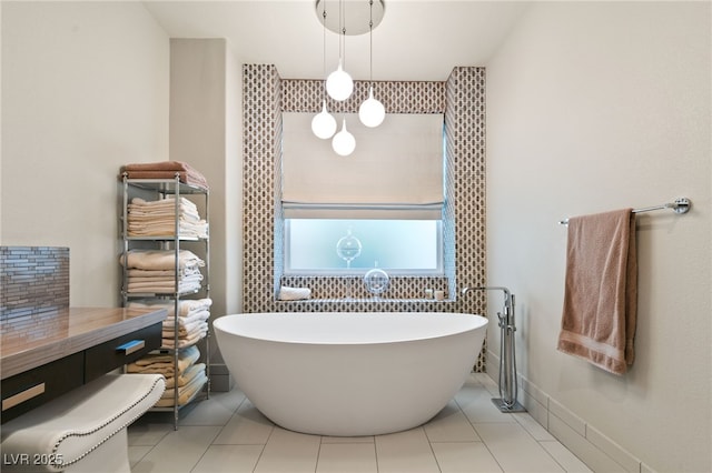 bathroom featuring a bath and tile patterned floors