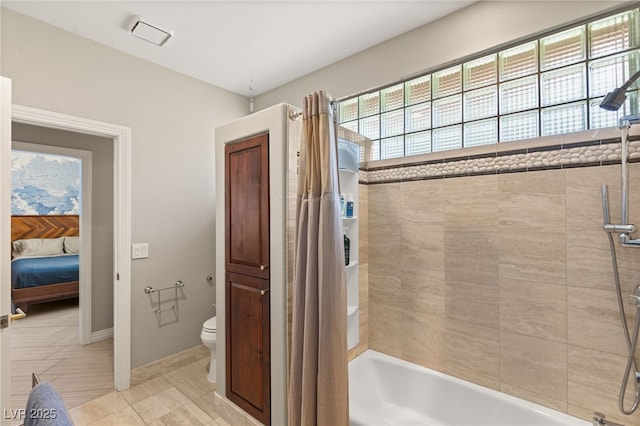 bathroom featuring shower / bathtub combination with curtain and toilet