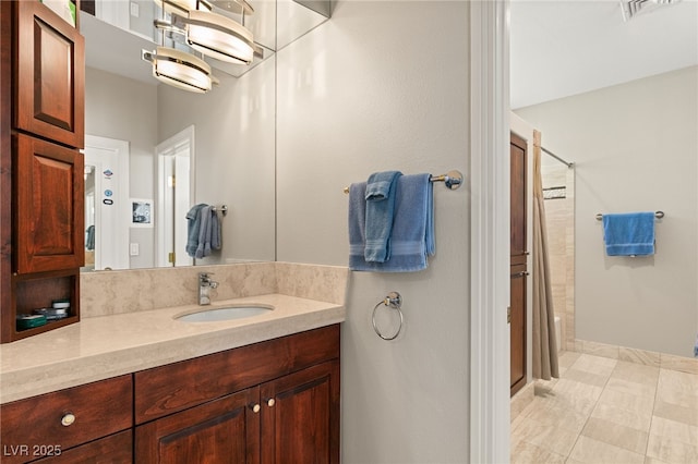 bathroom with an enclosed shower and vanity