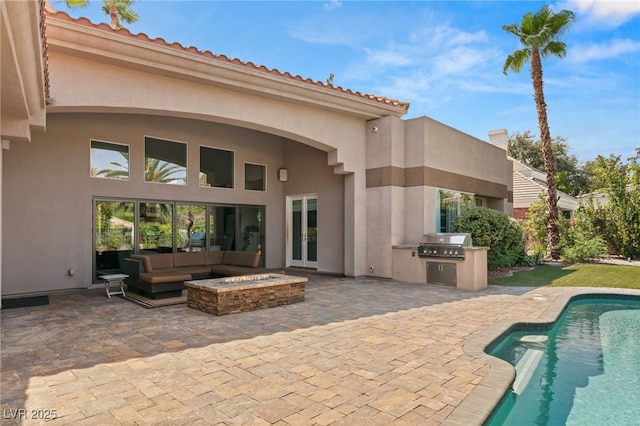 exterior space featuring area for grilling, an outdoor living space, and a patio