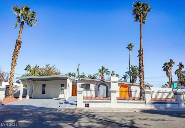 view of front of home featuring a carport