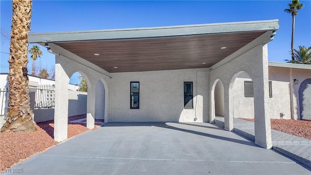 view of patio / terrace featuring a carport