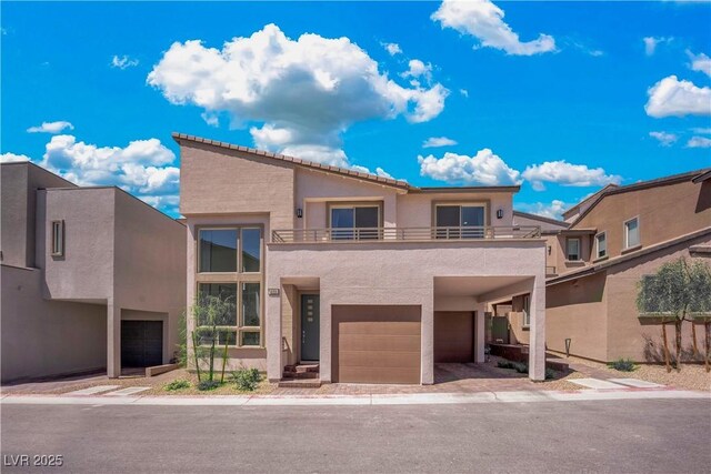 view of front of house with a balcony and a garage