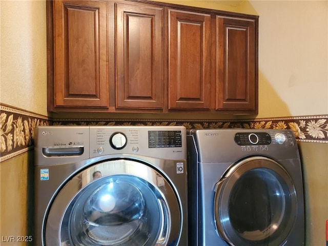 laundry area featuring cabinet space and independent washer and dryer